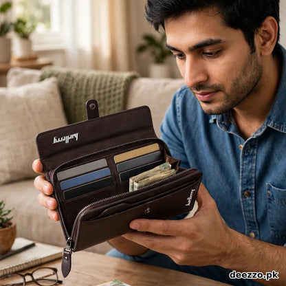 Man holding an open dark brown long wallet showing card slots and cash compartment